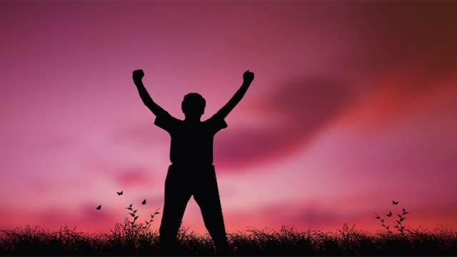 Man with arms raised
